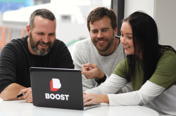 A Product Owner and developers check out the impact of the latest iteration of their software. Click to get Boost's recipe for successful software development.